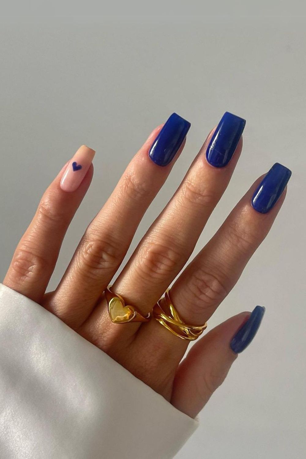 Royal blue mani with an accent heart