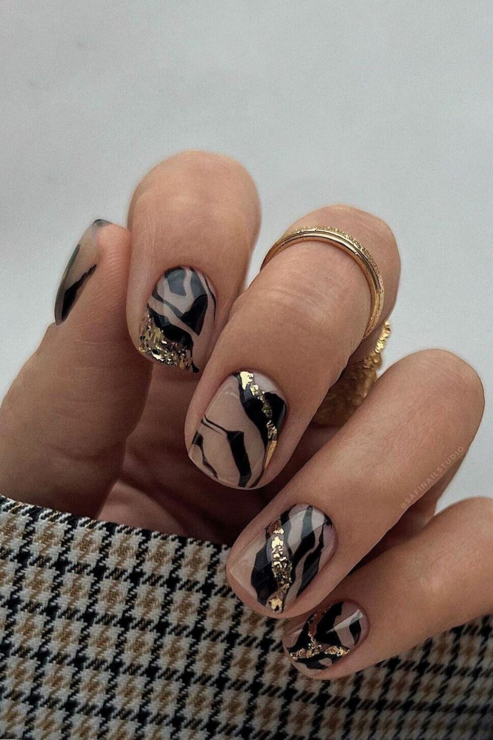 Black and gold zebra print nails